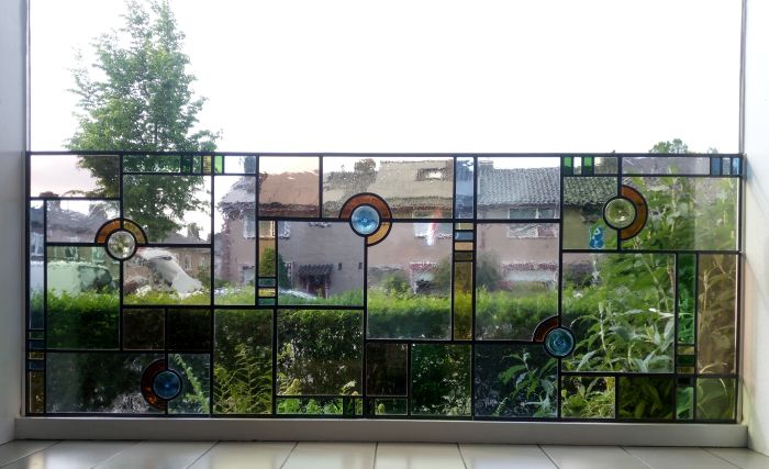 Glas in lood tegen isolatieglas gemonteerd